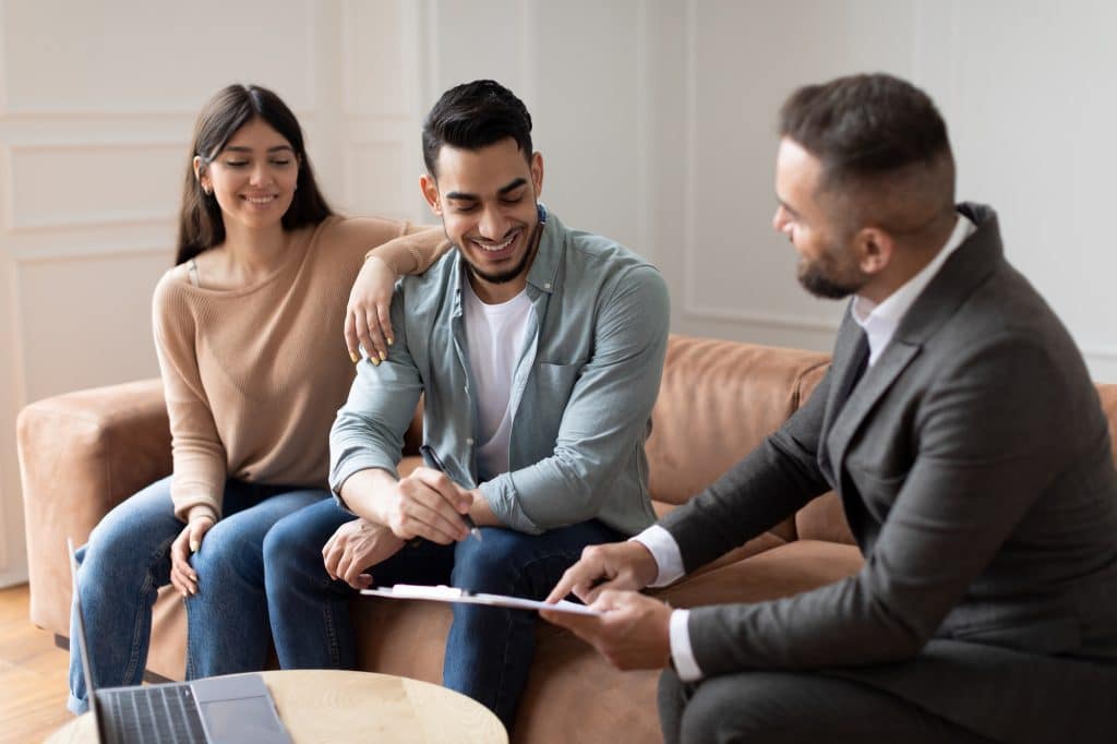 Real Estate Agent Showing Buyers Contract, Man Signing